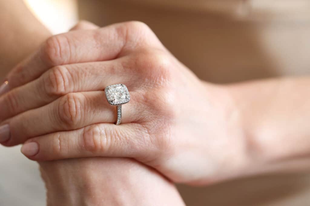 3ct Cushion cut diamond in a simple halo ring 